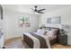 Cozy bedroom with neutral tones, a comfortable bed, and a window providing natural light at 1713 W Royal Palm Rd, Phoenix, AZ 85021