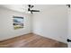 Well-lit bedroom with hardwood floors, a window view, and ample space for personalization at 1713 W Royal Palm Rd, Phoenix, AZ 85021
