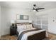 Calming bedroom with modern decor, large bed, and sliding door closet for ample storage at 1713 W Royal Palm Rd, Phoenix, AZ 85021