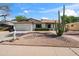 Charming single-story home featuring a two-car garage and a low-maintenance desert-style yard at 1713 W Royal Palm Rd, Phoenix, AZ 85021