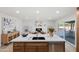 Open-concept kitchen with large island, stainless steel appliances and adjacent dining area at 1713 W Royal Palm Rd, Phoenix, AZ 85021