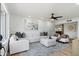 Bright living room with modern white furniture, accent pillows, and stylish decor at 1713 W Royal Palm Rd, Phoenix, AZ 85021