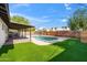 Great view of the backyard pool and patio area with lush green grass at 1713 W Royal Palm Rd, Phoenix, AZ 85021
