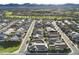 Wide aerial view of community featuring many homes and green spaces in a well-designed neighborhood at 17146 W Mountainair St, Surprise, AZ 85388