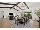 Open-concept dining area featuring a decorative chandelier and access to the outdoor patio and living room at 17146 W Mountainair St, Surprise, AZ 85388