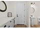 Hallway with a vanity, powder room, and access to other rooms in the home at 17146 W Mountainair St, Surprise, AZ 85388