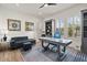 Stylish home office with a modern desk, comfortable seating, and bright natural light at 17146 W Mountainair St, Surprise, AZ 85388