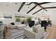 Bright living room with sliding glass doors to the backyard and open concept to the dining area at 17146 W Mountainair St, Surprise, AZ 85388