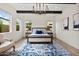 Main bedroom featuring natural light, a chandelier, and a cozy rug at 17146 W Mountainair St, Surprise, AZ 85388