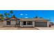 Charming single-story home with an attached garage and desert landscaping at 17201 N 35Th Dr, Glendale, AZ 85308