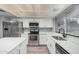 Modern kitchen featuring stainless steel appliances, white cabinets, and a sleek design, perfect for cooking and entertaining at 17201 N 35Th Dr, Glendale, AZ 85308