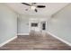Bright open-concept living room with new flooring and fresh paint, providing a welcoming flow to the kitchen at 17201 N 35Th Dr, Glendale, AZ 85308