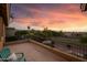 Sunset view from a spacious balcony overlooking scenic landscape, perfect for serene relaxation at 18432 W Port Royale Ln, Surprise, AZ 85388