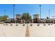 A baseball stadium with decorative baseballs and architectural entrance, representing community spirit and recreational amenities at 18432 W Port Royale Ln, Surprise, AZ 85388