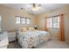 Bedroom with two twin beds pushed together to make a larger bed at 18432 W Port Royale Ln, Surprise, AZ 85388