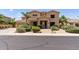 Beautiful two-story home with desert landscaping and a well-maintained front yard at 18432 W Port Royale Ln, Surprise, AZ 85388
