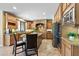 Beautiful kitchen featuring custom cabinetry, a center island, and modern appliances at 18432 W Port Royale Ln, Surprise, AZ 85388