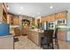 Spacious kitchen boasts granite countertops, an island with seating, and stainless steel appliances at 18432 W Port Royale Ln, Surprise, AZ 85388