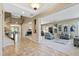 Elegant living room and staircase, showcasing open layout and natural light at 18432 W Port Royale Ln, Surprise, AZ 85388
