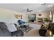Cozy living room with fireplace, plush seating, and stylish decor for relaxation at 18432 W Port Royale Ln, Surprise, AZ 85388