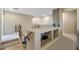 Loft area with built-in shelving and access to several bedrooms at 18432 W Port Royale Ln, Surprise, AZ 85388