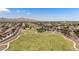 Picturesque community park with vast green spaces, playground, and walking paths, perfect for recreation and leisure at 18432 W Port Royale Ln, Surprise, AZ 85388