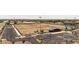 A listing photo shows the grassy recreational fields adjacent to the parking area at 18432 W Port Royale Ln, Surprise, AZ 85388