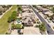 Aerial view of homes with backyard pools, solar panels, and neighborhood streets at 18432 W Port Royale Ln, Surprise, AZ 85388