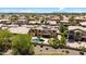 Aerial view of a home featuring a pool, solar panels and nicely landscaped backyard at 18432 W Port Royale Ln, Surprise, AZ 85388