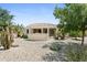 Expansive backyard with a pergola, BBQ area, and desert landscaping, ideal for outdoor living and entertaining at 18634 N Paloma Ct, Surprise, AZ 85387