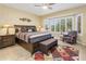 Inviting bedroom with a large bed, bay window, and decorative accents creating a relaxing atmosphere at 18634 N Paloma Ct, Surprise, AZ 85387