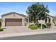 Charming single-story home with low-maintenance desert landscaping and a paver driveway at 18634 N Paloma Ct, Surprise, AZ 85387