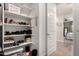 Neatly organized shoe and shelving area, leading to the bedroom and providing functional storage solutions at 1882 S Jesse Pl, Chandler, AZ 85286