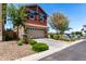 Exterior view of a two-story home with a two-car garage and landscaped front yard at 1882 S Jesse Pl, Chandler, AZ 85286