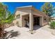 Charming backyard featuring a brick patio, lush landscaping, and covered outdoor space at 1887 W Periwinkle Way, Chandler, AZ 85248