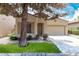 Well-kept home exterior with a tidy lawn and an attached two-car garage at 1887 W Periwinkle Way, Chandler, AZ 85248