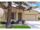 Charming single-story home with well-maintained landscaping and attached two-car garage at 1887 W Periwinkle Way, Chandler, AZ 85248