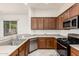 Well-appointed kitchen with stainless steel appliances, updated fixtures, and ample storage at 1887 W Periwinkle Way, Chandler, AZ 85248