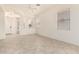 Bright and airy living room with neutral paint, tile floors, and modern ceiling fan at 1887 W Periwinkle Way, Chandler, AZ 85248