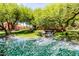 Beautiful pond with a bridge and waterfall, creating a peaceful and inviting outdoor space at 1887 W Periwinkle Way, Chandler, AZ 85248