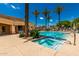 Community pool features a large swimming pool and hot tub, palm trees, and lounge seating at 1887 W Periwinkle Way, Chandler, AZ 85248