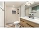 Updated bathroom featuring matte black finishes, white vanity top, and glass-enclosed shower at 19013 N 18Th Ave, Phoenix, AZ 85027