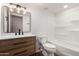 Updated bathroom with wood vanity, matte black finishes, and shower-tub combination at 19013 N 18Th Ave, Phoenix, AZ 85027