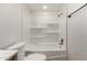 Clean bathroom featuring shower-tub combination with built-in shelving and white finish at 19013 N 18Th Ave, Phoenix, AZ 85027