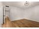 Bedroom with hardwood floors and modern light fixture at 19013 N 18Th Ave, Phoenix, AZ 85027