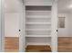 Hallway linen closet with full-length shelves, conveniently located near other rooms at 19013 N 18Th Ave, Phoenix, AZ 85027