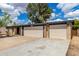 The front exterior features a charming brick facade, a two-car garage, and desert landscaping at 19013 N 18Th Ave, Phoenix, AZ 85027