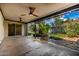 Covered patio featuring ceiling fans and a smooth transition to the landscaped backyard at 19013 N 18Th Ave, Phoenix, AZ 85027