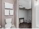 Functional bathroom with a toilet, closet, and towel rack, providing essential amenities in a compact space at 1920 E Bell Rd # 1189, Phoenix, AZ 85022