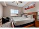 Relaxing bedroom with a king-size bed, large window, and ceiling fan, creating a comfortable and inviting space at 1920 E Bell Rd # 1189, Phoenix, AZ 85022